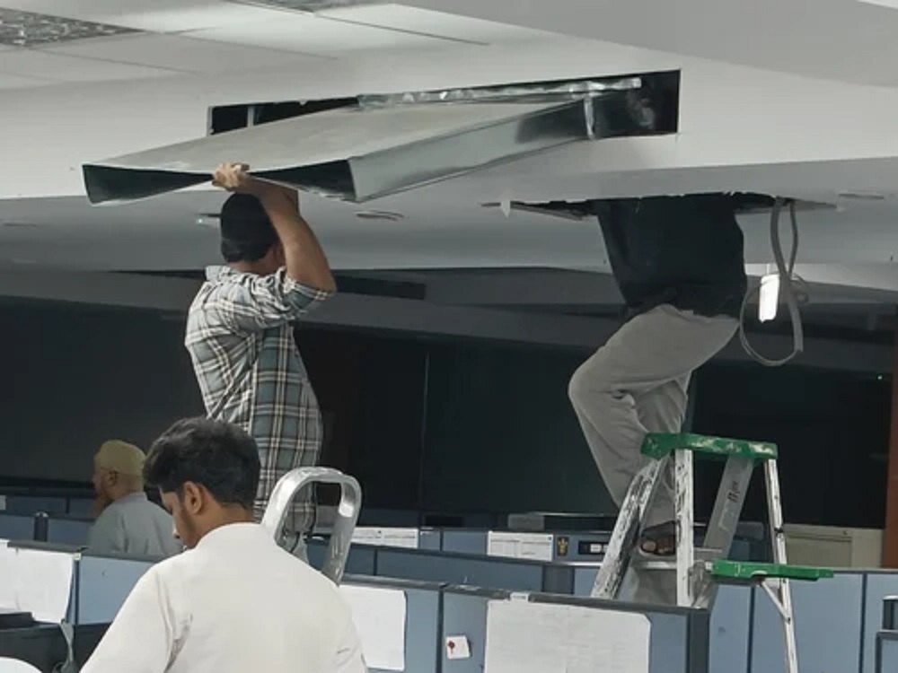 old AC buyers in Financial District - Phoenix AC Service technician inspecting and repairing AC unit